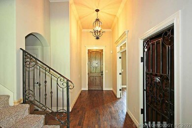 Large Entry with custom wrought iron stair railing