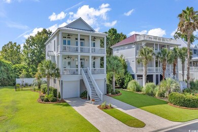 Coastal home featuring a front yard and a porch