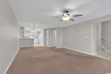 Unfurnished living room featuring a textured ceili