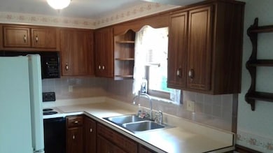 Kitchen offers plenty of cabinet storage and enjoy