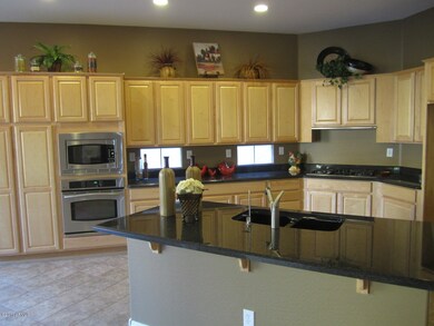 Gourmet kitchen w/ slab granite
