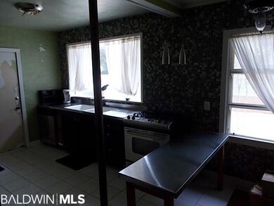 Kitchen has Stainless steel countertops