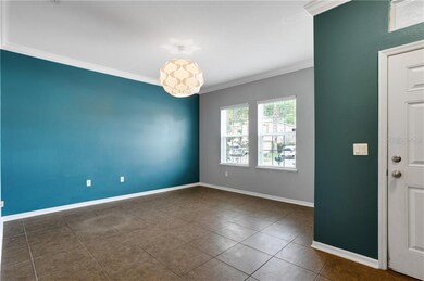 Your formal dining area features crown molding and