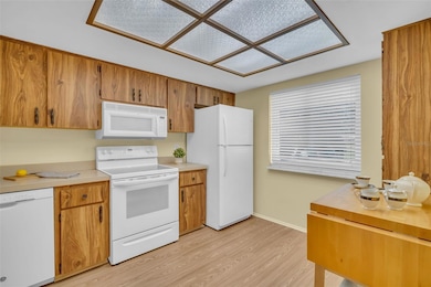 Newer flooring & window, matching appliances, & generous cabinets~