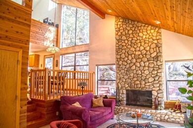 Living room with  rock fireplace