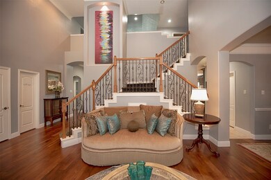 The double staircase leads to and from upstairs to the kitchen.