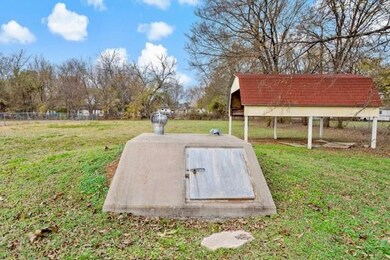View of storm shelter with a yard
