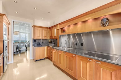 Bright and light, this kitchen has views and open to both sides of the Apt.