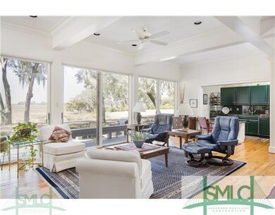 Casual seating area of Great Room. Blue leather ch