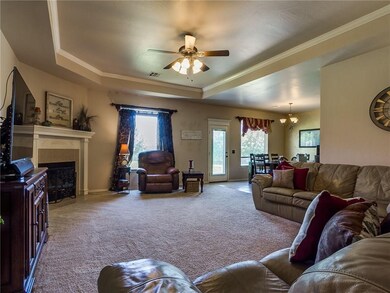 Open floor plan. Tray ceiling and gas log fireplac