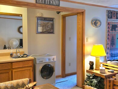 Washer-dryer combo beside wetbar