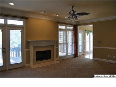 Family Room with doors to deck, transom windows, u