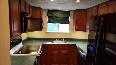 Beautiful Kitchen features range, trash masher, di