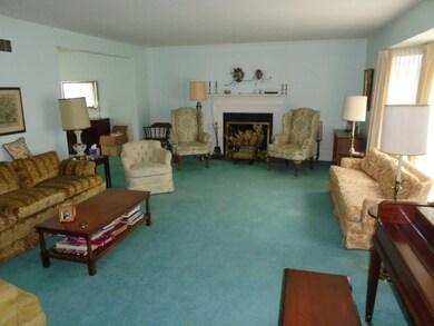 Living Room with Marble Fireplace