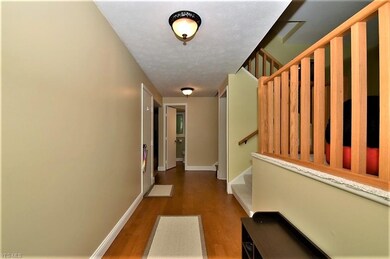 Foyer entry with beautiful hardwood floors.