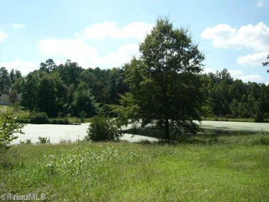 Exterior Front. pond in front of home