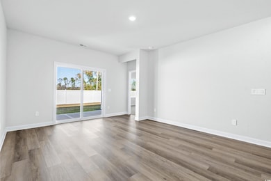 Unfurnished room featuring light wood-type floorin