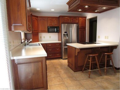 Kitchen 13 x 9 with breakfast bar.