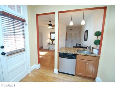 Kitchen - Built-in dishwasher and balcony access.