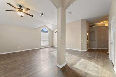 Unfurnished room with dark hardwood / wood-style f