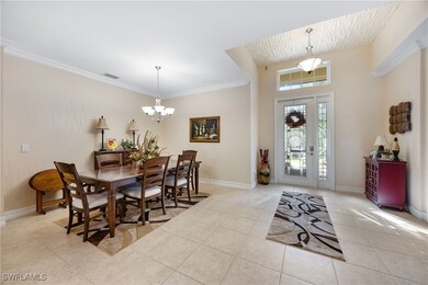 Tiled dining area with an inviting chandelier and