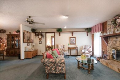 Front living room with a wood burning fireplace