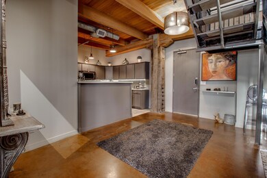 Expansive entry open to the kitchen featuring wood