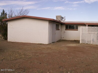 S side of house - attached storage room