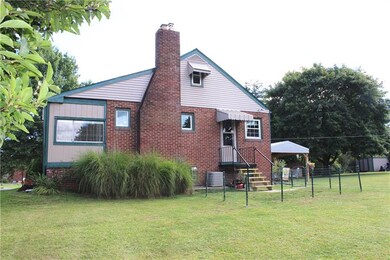 Spacious side yard has a convenient door great for