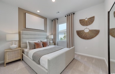 Bedroom featuring baseboards, carpet floors, visib