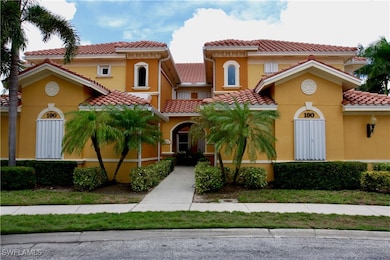 Mediterranean / spanish house attached villas featuring stucco siding and a tiled roof