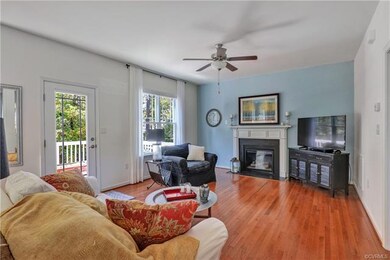 Family room with gas fireplace and hardwood floors