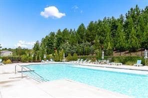 Beautiful shimmering pool at the clubhouse with bathing ledge