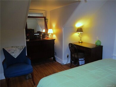 Second floor bedroom with fresh paint and hardwood