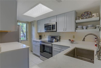 Newly updated kitchen with quartz countertops, sof