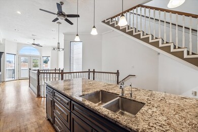 Kitchen opens to the light and bright family room-