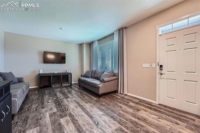 Living area with wood finished floors