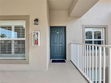 View of exterior entry featuring a balcony