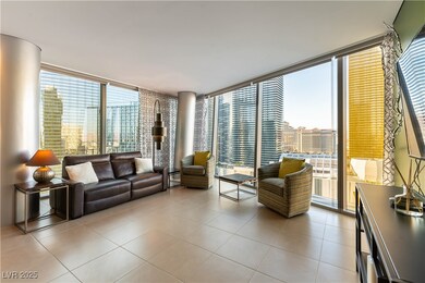 Living room with expansive windows and light tile