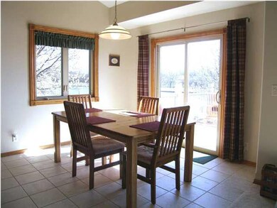 Dining room overlooks the lake and has easy care c