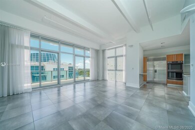 OPEN LIVING ROOM WITH HIGH CEILINGS
