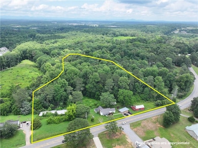 Aerial overview of property's location featuring property boundaries highlighted