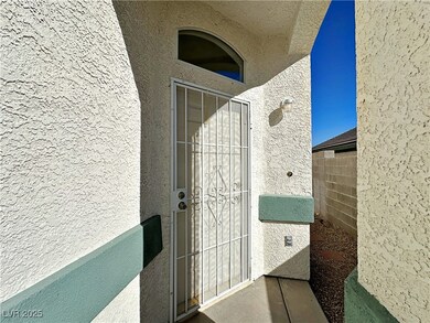 Entrance to property featuring stucco siding