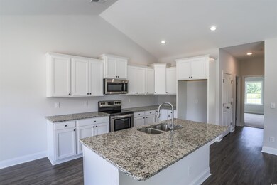 Kitchen with white cabinetry, stainless steel appl