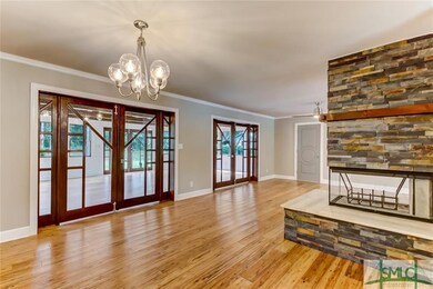 Dining area opens to living and sun porch. The sta
