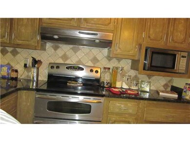 Granite counters, tile bacsplash, tile floors, win