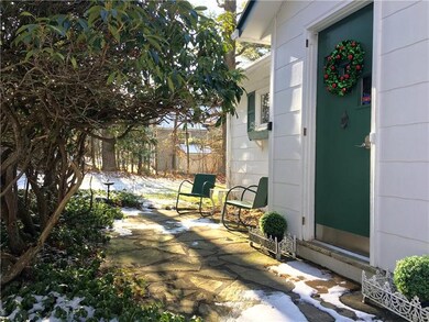 Enjoy a quiet respite on the front flagstone patio