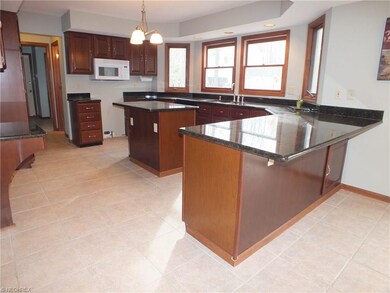 Entertain in the spacious Kitchen with Granite and