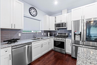 Kitchen featuring stainless steel appliances, dar