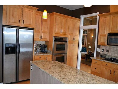 Kitchen. Double ovens, work desk to left, and mudroom with bench/hooks perfect for everyday routine.